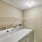 Laundry room with washer, dryer, and shelves