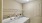 Laundry room with washer, dryer, and shelves