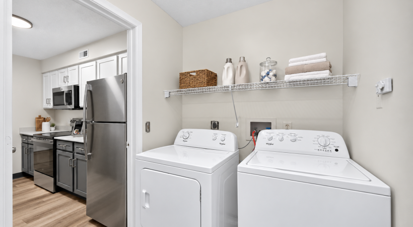Staged upgraded apartment kitchen with white walls
