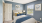 Staged bedroom with blue and yellow decor