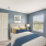 Staged bedroom with blue and yellow decor
