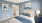 Staged bedroom with sailboat wall art