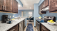 Staged upgraded apartment kitchen with blue runner