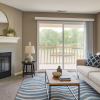 Staged living room with blue and yellow decor